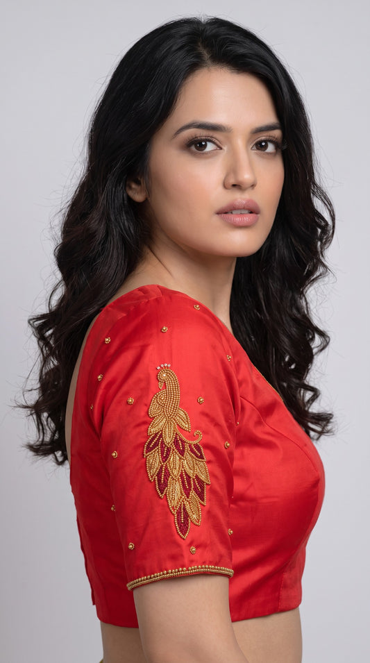 SurpriseLadies blouse red designer handwork Ari work blouse featuring intricate gold peacock embroidery on the sleeve